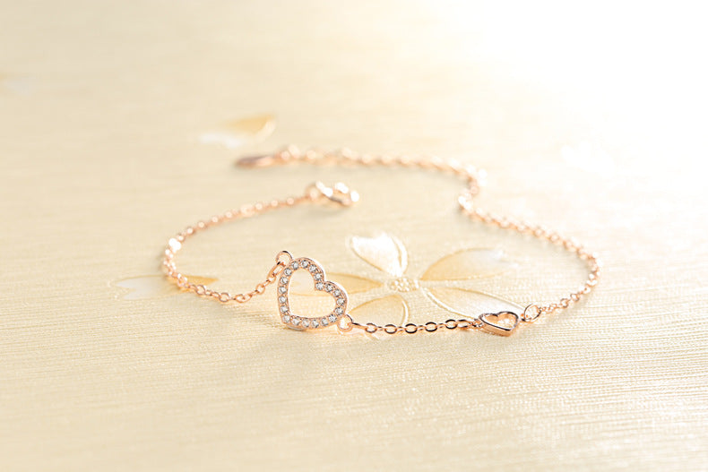 Tiny diamond-studded heart bracelet